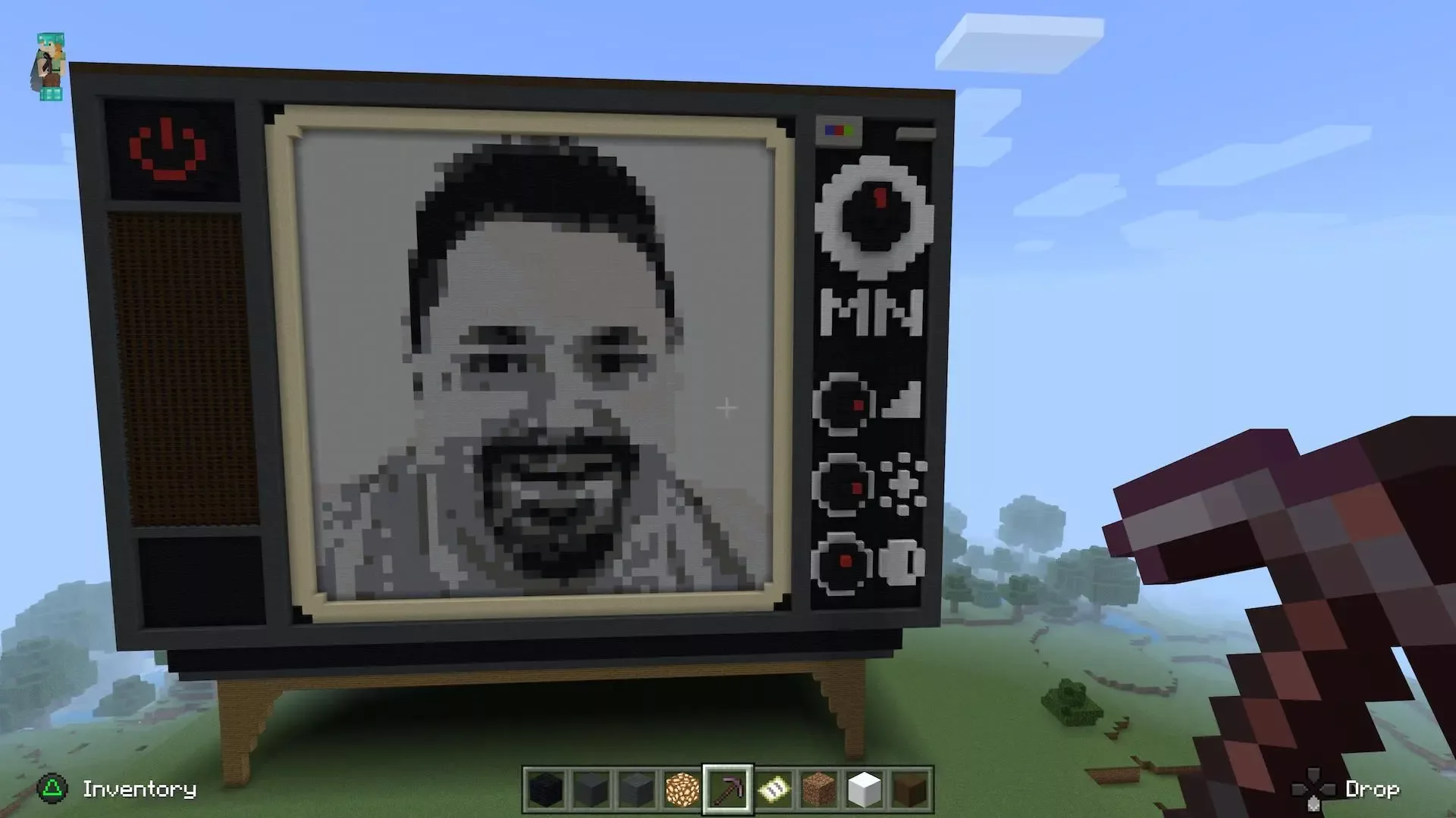 A tribute to Paul's friend Mark - a pixel art rendition of Mark’s face, rendered in a cathode-ray TV within Minecraft